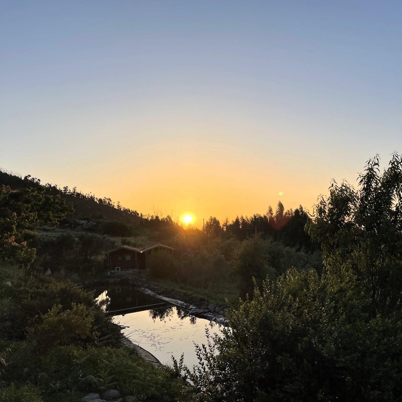 Sunset over the pond and the land of Karuna Retreat Center, Monchique, Portugal